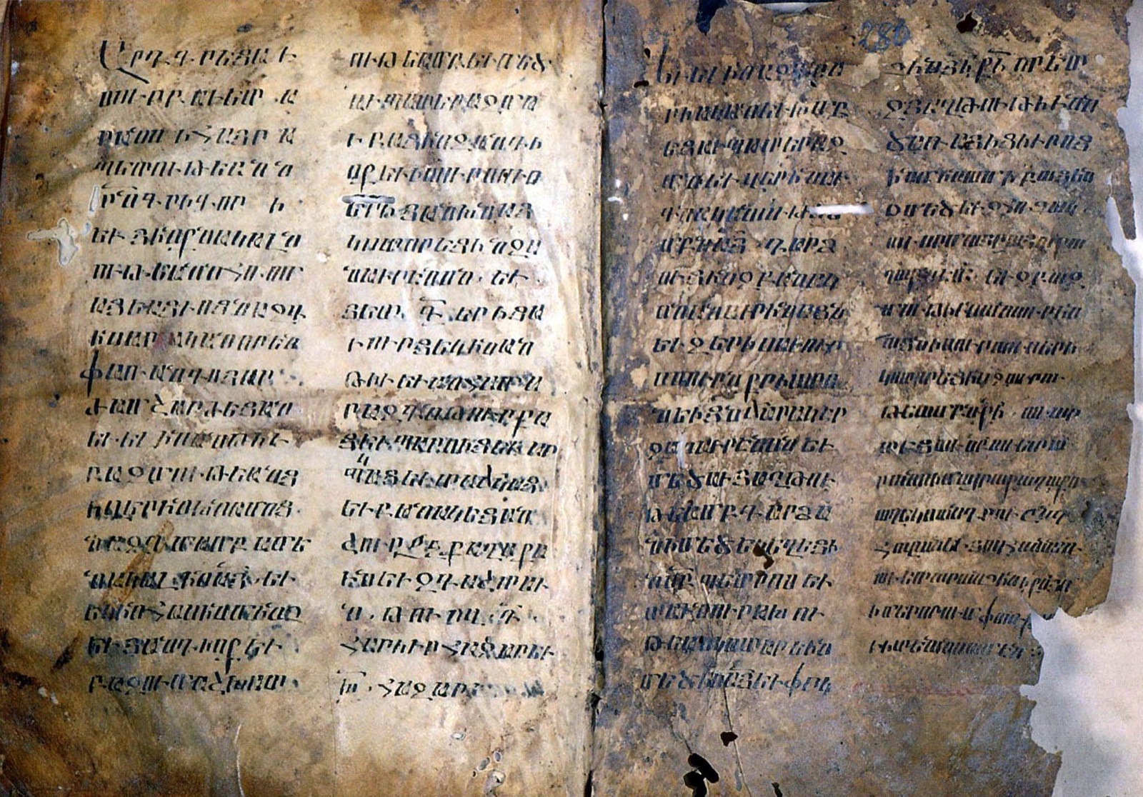 A page of a medieval Armenian manuscript covered in hand-copied script — a colophon, the scribe's closing note, dated 1099.