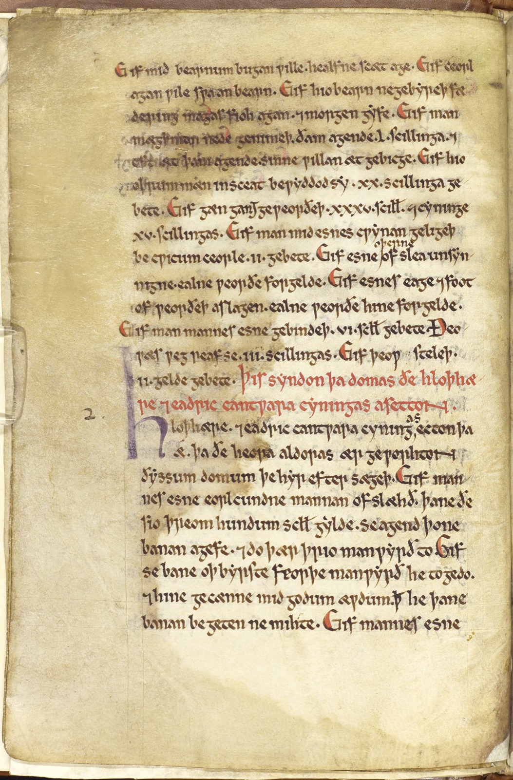 A page of the twelfth-century Textus Roffensis: one column of dark insular script in Old English, with a line of red rubric partway down and a large decorated initial beside it, marking the opening of the laws of the Kentish kings Hlothhere and Eadric.